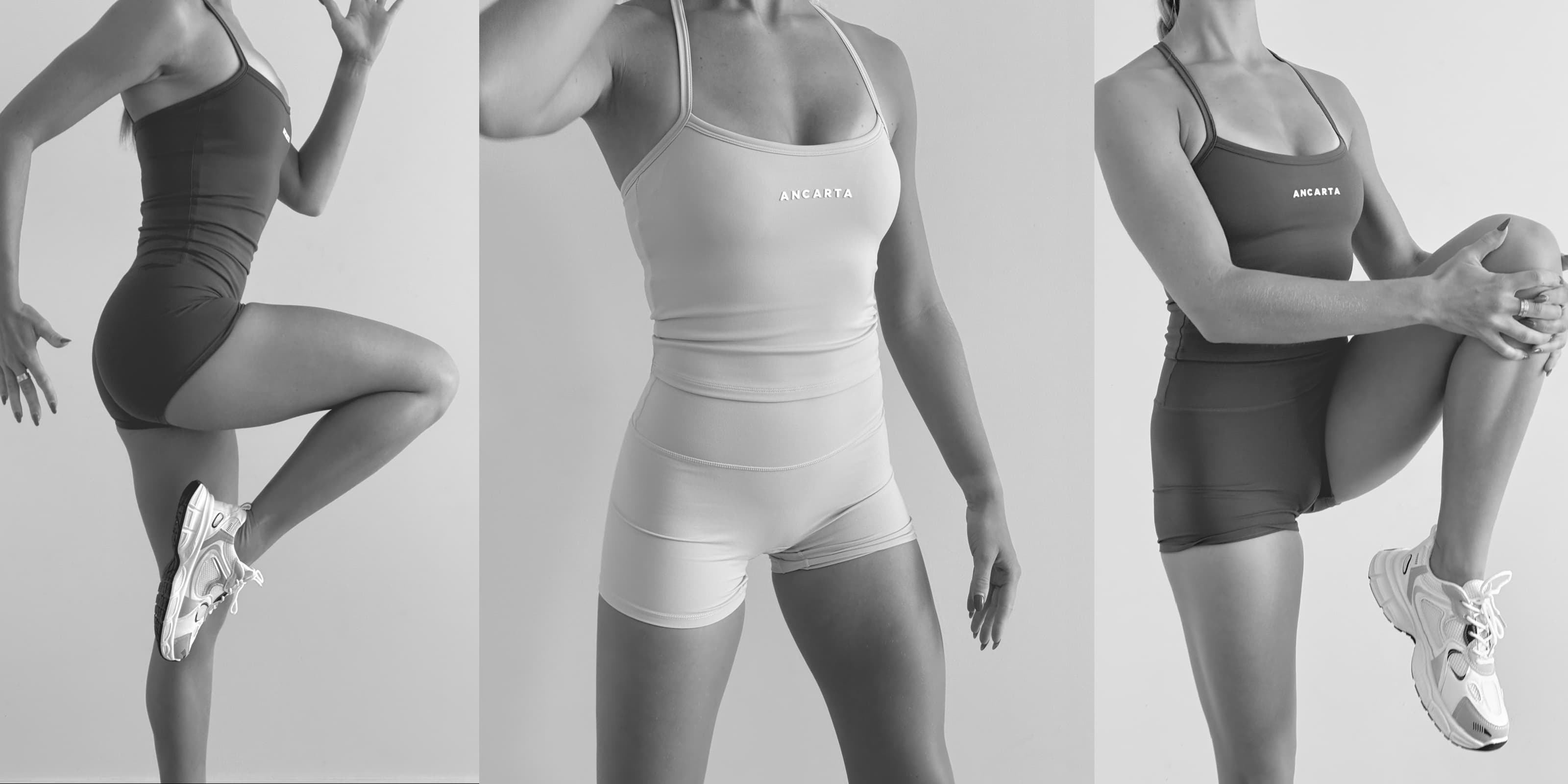Model wearing ANCARTA’s Vital Set in soft spandex, showcasing the matching sports bra and shorts from the front. Minimalist studio backdrop with ANCARTA logo visible on the top.